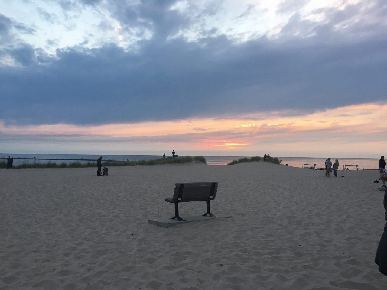 A bench on a beach
Description automatically generated