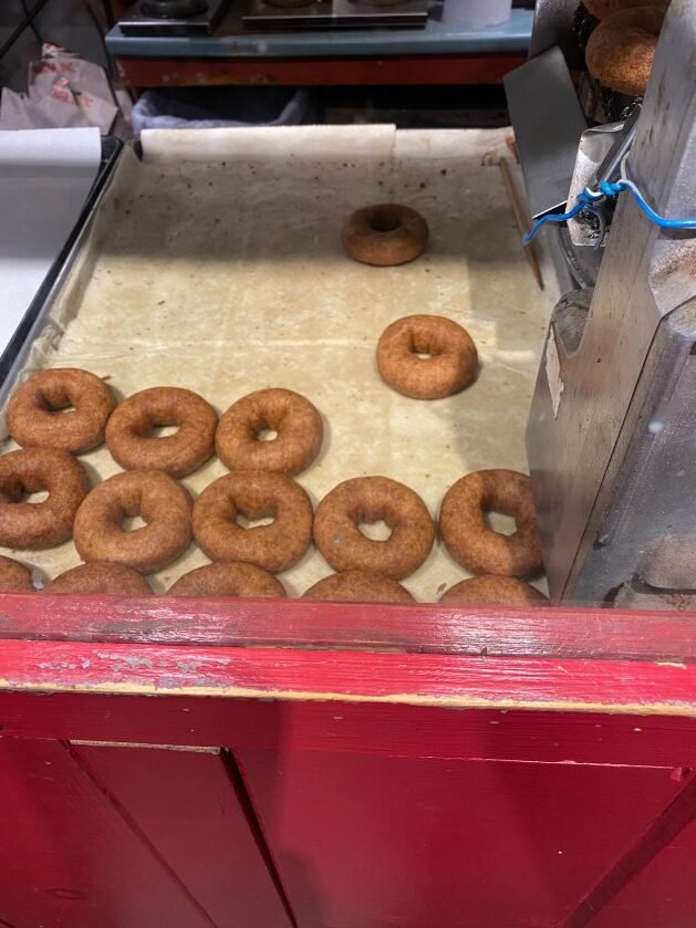 A box of donuts
Description automatically generated