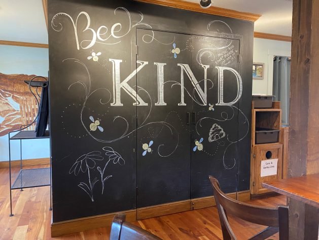 A chalkboard with writing on it
Description automatically generated with medium confidence