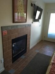 A fireplace in a room
Description automatically generated
