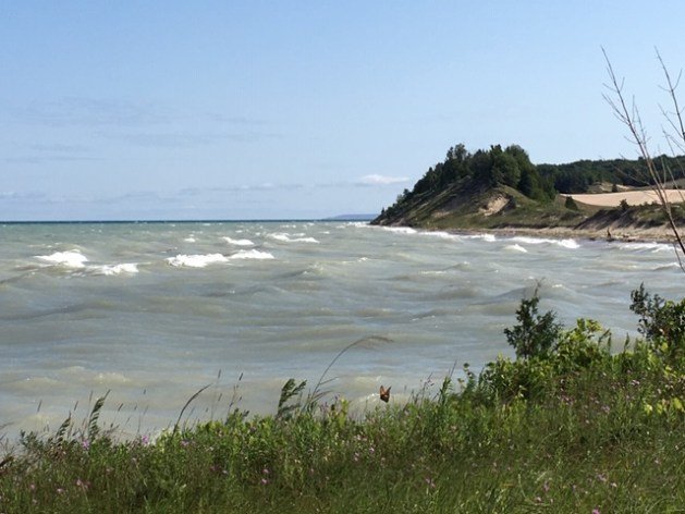 A long shot of a lake
Description automatically generated