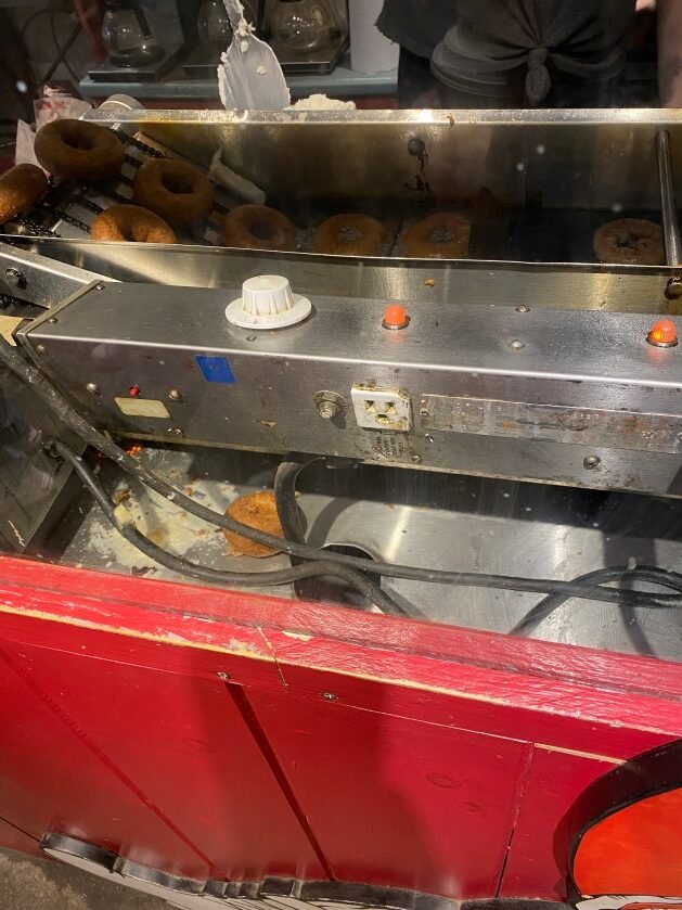 A machine with donuts on it
Description automatically generated