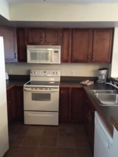 A picture containing cabinet, indoor, kitchen, refrigerator Description automatically generated