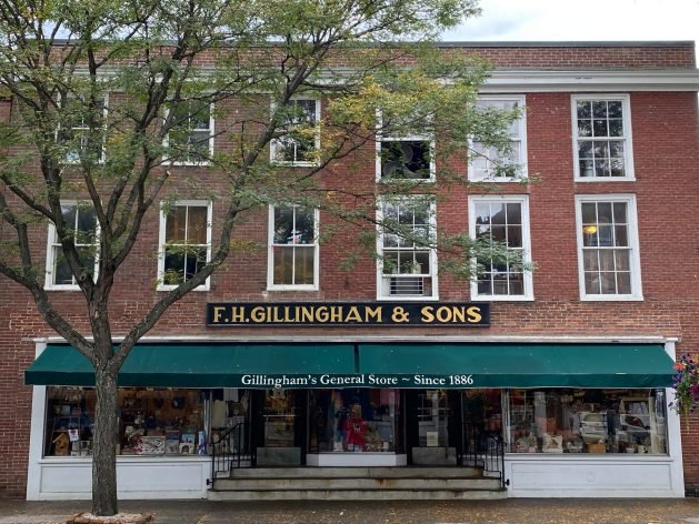 A picture containing text, building, outdoor
Description automatically generated