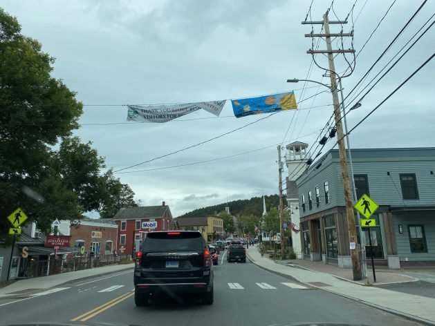 A picture containing text, sky, outdoor, road
Description automatically generated