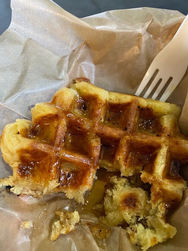 A waffle with a fork
Description automatically generated